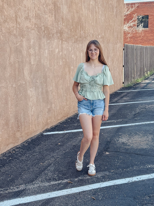 The Sage Blossom Peplum Tie Front Top