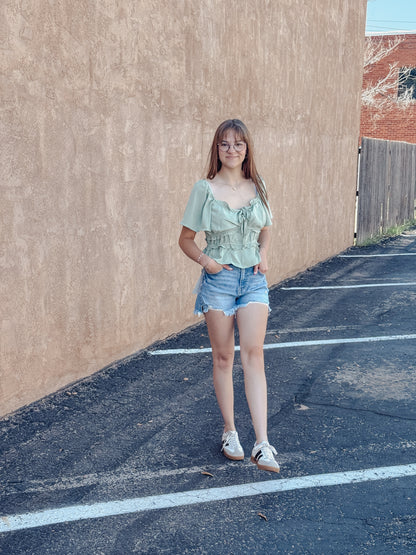 The Sage Blossom Peplum Tie Front Top
