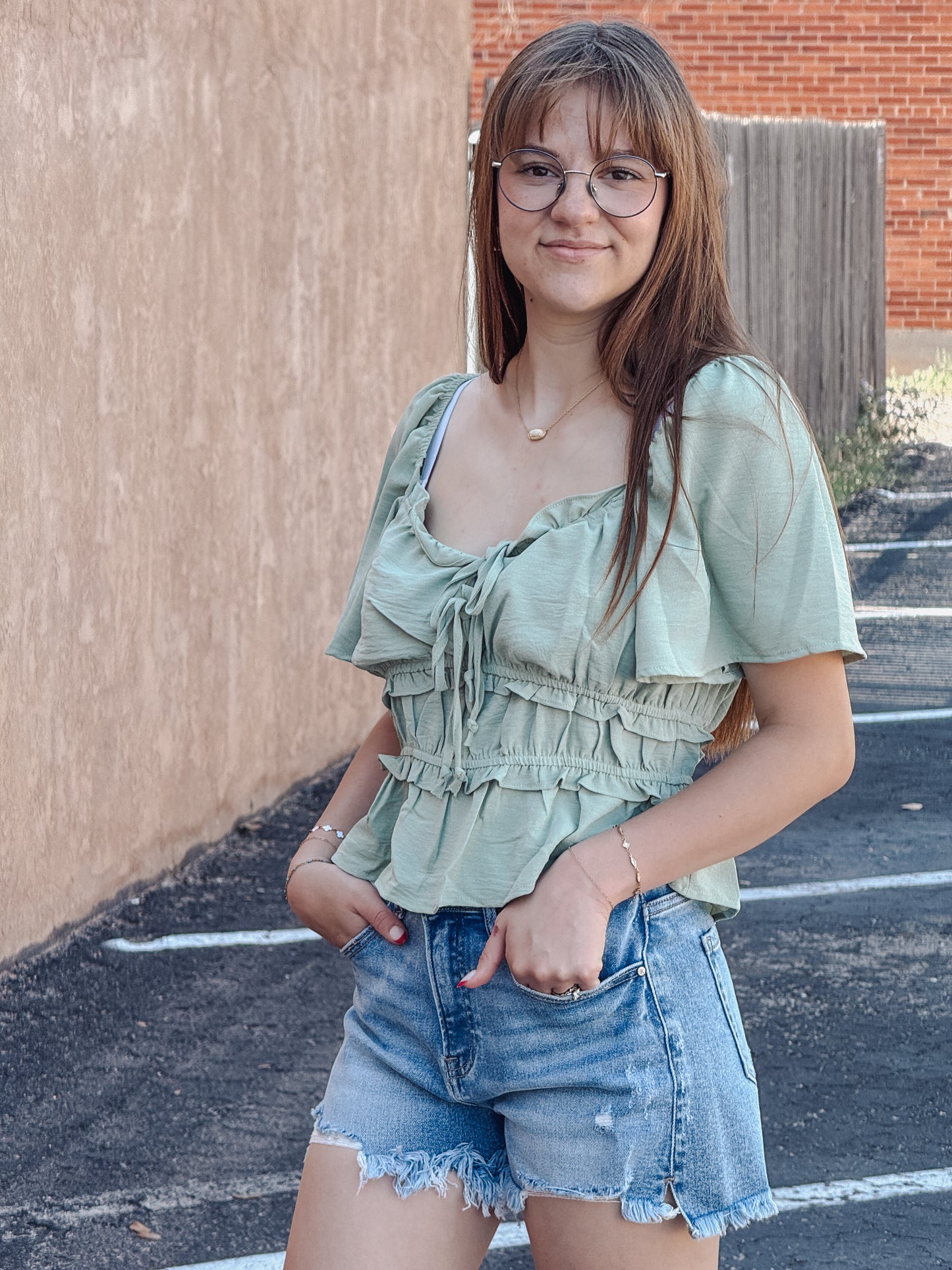 The Sage Blossom Peplum Tie Front Top